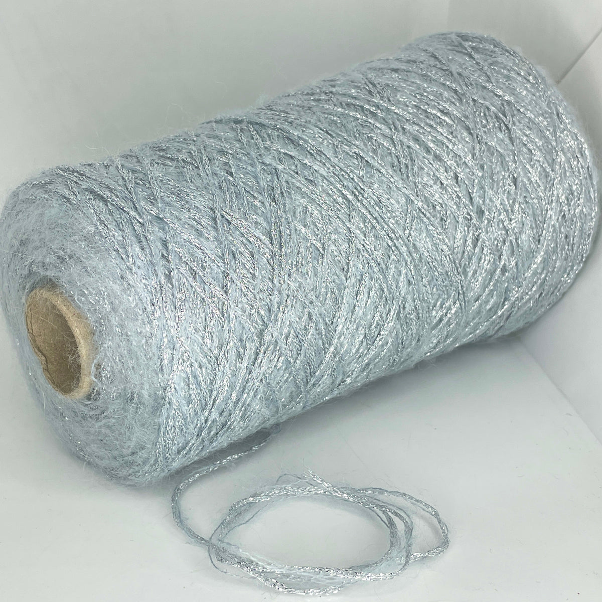 12% Mohair, 32% Polyester, 16% Acrylic, 40% Nylon